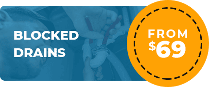 Advertisement image for blocked drain services shows a plumber working on plumbing pipes. Text to the left reads "BLOCKED DRAINS," and a yellow circle on the right features "FROM $69." With a blue overlay in the background, trust your local Plumber Sydney for effective solutions.