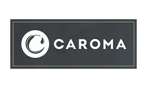 A black rectangular logo with a white circle on the left containing a white crescent-like swirl with a tear-shaped drop. The word "CAROMA" is written in bold white capital letters to the right of the circle, emphasizing quality that top plumbers in Sydney trust. A thin white border outlines the rectangle.